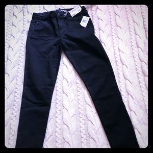 Celebrity Pink-Denim black mid-rise skinny jeans.